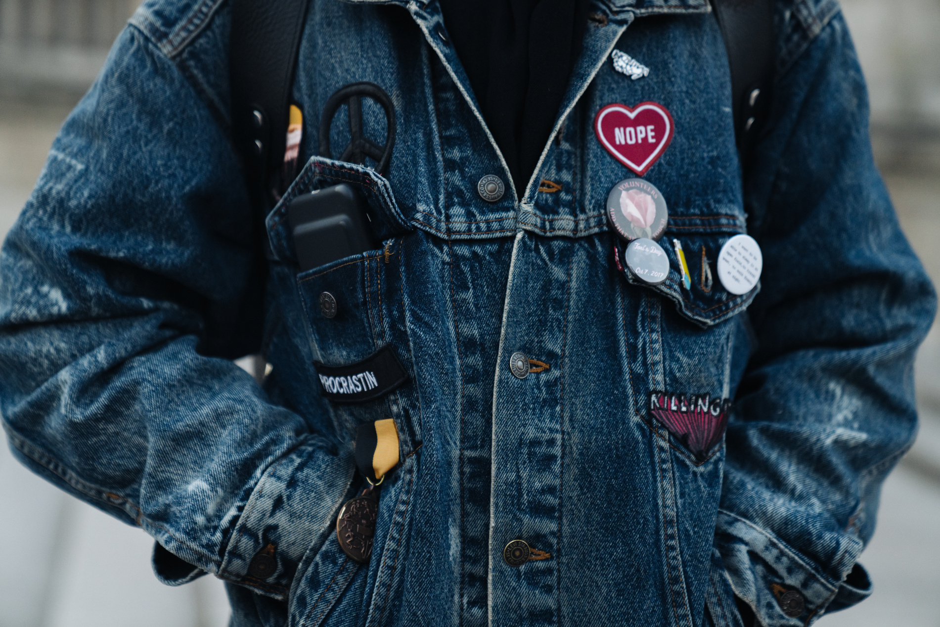 Close Up of Person's Denim Jacket with Patches 